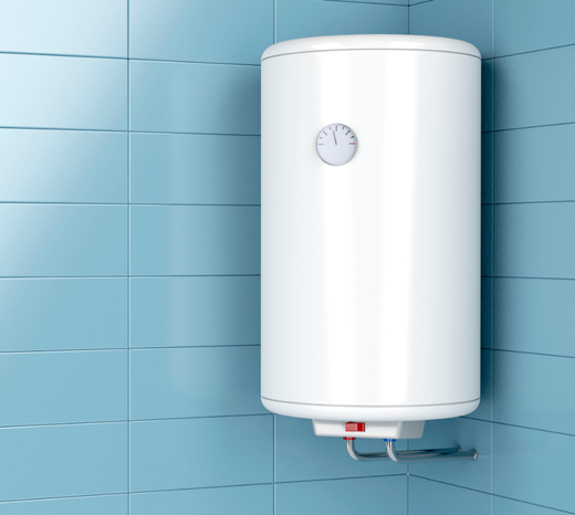 Wall-mounted white electric water heater in a bathroom with blue tiled walls.